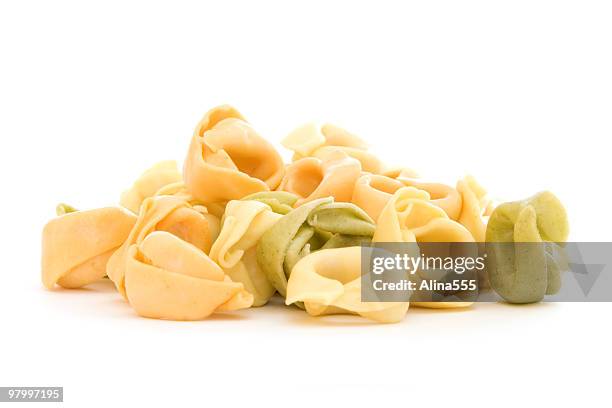 pile of tortellini shells on white - tortellini bildbanksfoton och bilder