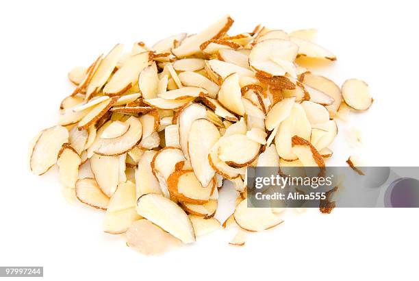 pile of  sliced almonds on white - almonds on white stock pictures, royalty-free photos & images