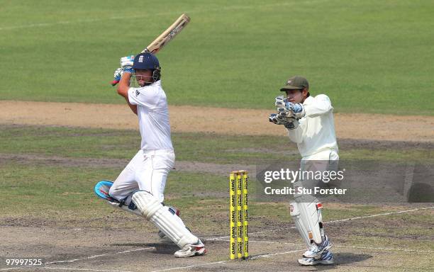 England batsman Alastair Cook cuts the ball to the boundary watched by wicketkeeper Mushfiqur Rahim during day five of the 2nd Test match between...