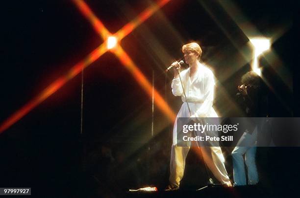 David Bowie and Simon House perform on stage at Earls Court Arena on August 28th, 1978 in London, England.