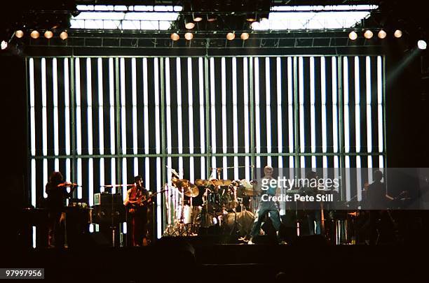 David Bowie performs on stage, with L-R Simon House, Carlos Alomar Dennis Davis , David Bowie, George Murray and Adrian Belew, at Earls Court Arena...