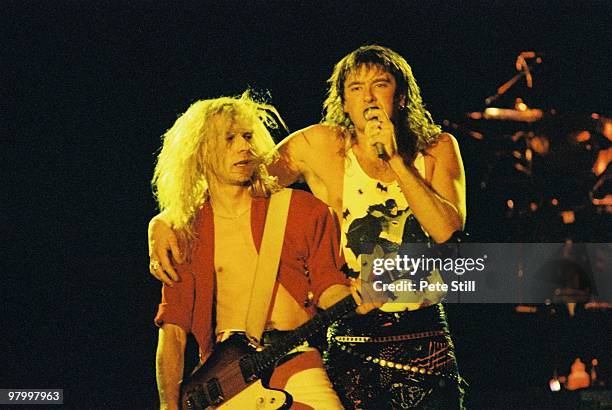 Steve Clark and Joe Elliott of Def Leppard perform on stage at Wembley Arena on April 12th, 1988 in London, England, on their 'Hysteria' world tour.