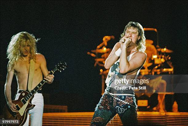 Steve Clark and Joe Elliott of Def Leppard perform on stage at Wembley Arena on April 12th, 1988 in London, England, on their 'Hysteria' world tour.