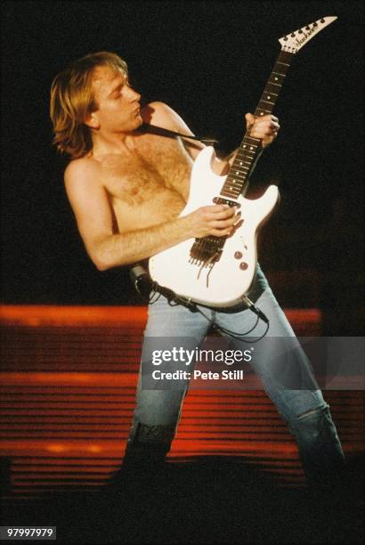 Phil Collen of Def Leppard performs on stage at Wembley Arena on April 12th, 1988 in London, England, on their 'Hysteria' world tour.