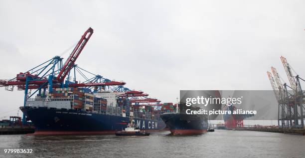 March 2018, Germany, Hamburg: The container ship "Antoine de Saint Exupery" of the CMA CGM shipping company at the container terminal Burchardkai ,...