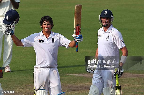 England captain Alastair Cook raises his bat after reaching his century as Kevin Pietersen applauds during day five of the 2nd Test match between...
