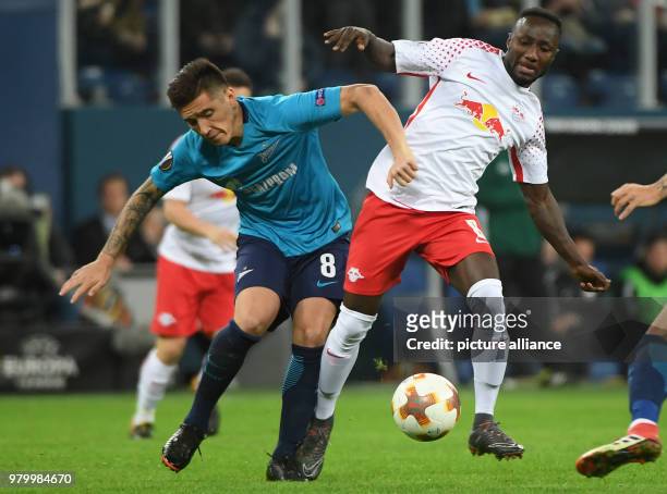 Leipzig's Naby Keita and St. Petersburg's Matias Kranevitter battle for the ball during the UEFA Europa League round of 16 second leg soccer match...