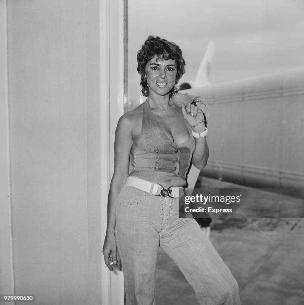 Jane Raymond, wife of English publisher, club owner, and property developer Paul Raymond , at Heathrow Airport, London, UK, 29th January 1974.