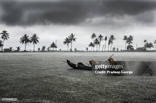 fishing boat in rain, kerala, india - india rain stock pictures, royalty-free photos & images
