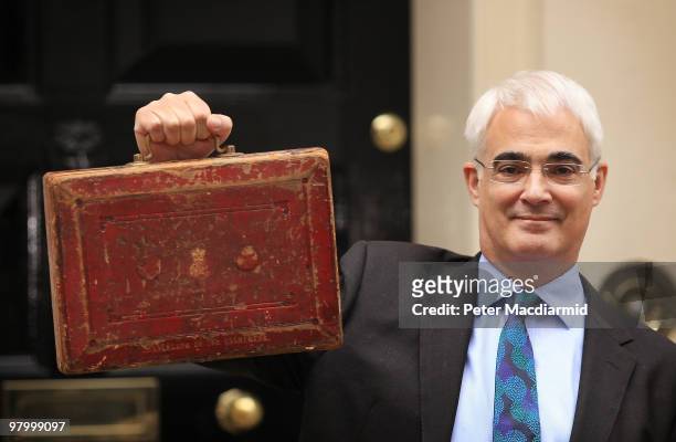 Chancellor of the Exchequer Alistair Darling holds Disraeli's original budget box outside number 11 Downing Street on March 24, 2010 in London,...