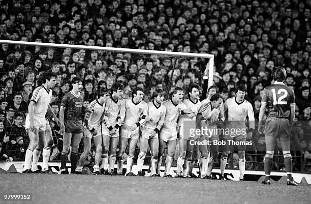 The entire West Ham United team line up in front of the Anfield Kop to form the defensive wall during their Football League Milk Cup 5th round match...