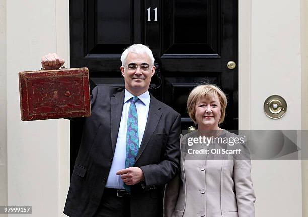 Chancellor of the Exchequer Alistair Darling holds Disraeli's original budget box next to his wife, Maggie Darling, outside number 11 Downing Street...