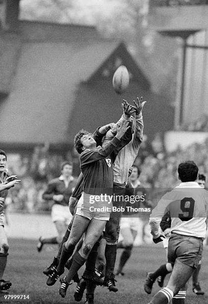 Hugo McNeil of Ireland jumps for the ball with Jean-Luc Joinel of France during the Rugby Union International match held at Lansdowne Road, Dublin on...