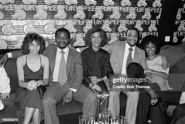 West Bromwich Albion footballers Laurie Cunningham and Cyrille Regis with the American singers The Three Degrees in the VIP area at the Holy City Zoo...