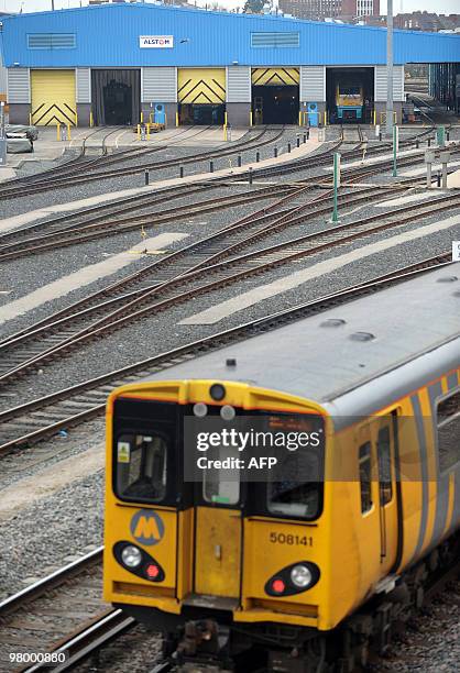 Train passes the Alstom maintenance depot in Chester, north-west England, on March 24, 2010. Three members of the board of French engineering group...