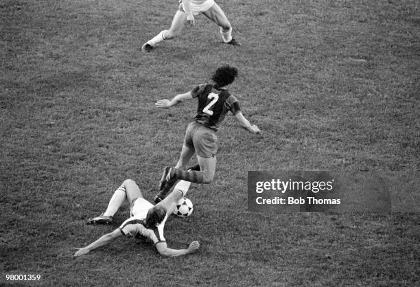 Sliding tackle from behind by Fortuna Dusseldorf defender Dieter Brei halts Barcelona's Zuviria during the European Cup Winners Cup Final between...