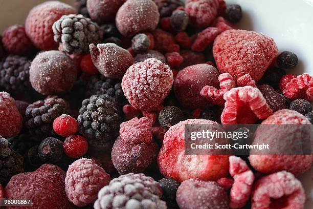 mixed berries - frozen berries stock pictures, royalty-free photos & images