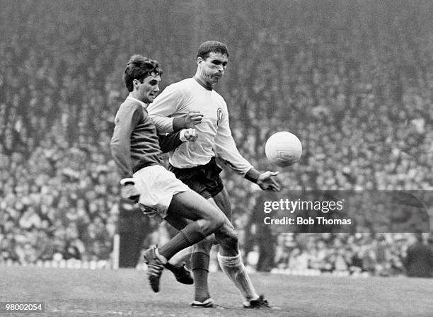 George Best of Manchester United is challenged by Liverpool defender Ron Yeats during their Division One league match at Old Trafford, Manchester,...