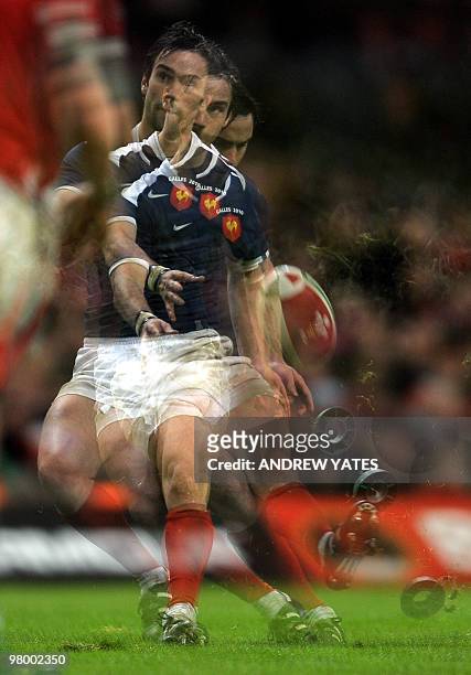 This multiple exposure picture shows France's Morgan Parra kicking a penalty during the Six Nations international between Wales and France at the...