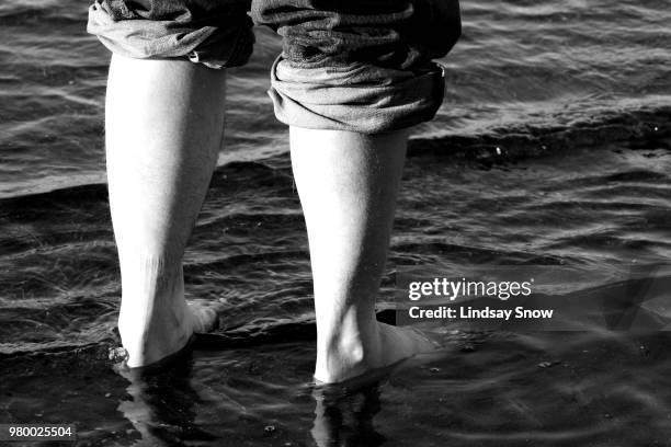 wading - barefoot snow stock pictures, royalty-free photos & images