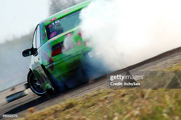 car drifting on a race track - car mid air stock pictures, royalty-free photos & images