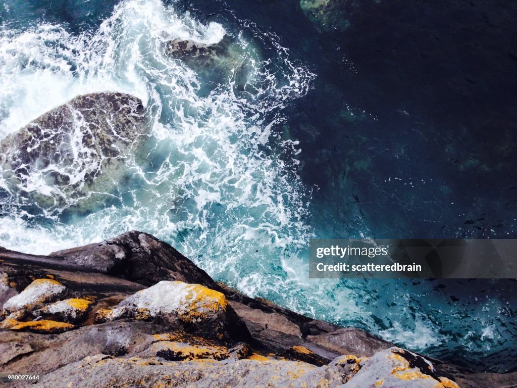 Looking down Cliffs of Moher on seashore, Doolin, County Clare, Ireland