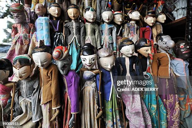 "Wayang golek" or golek puppets are displayed at the Jalan Surabaya antique market in Jakarta on March 23, 2010. The antique market at Jalan Surabaya...