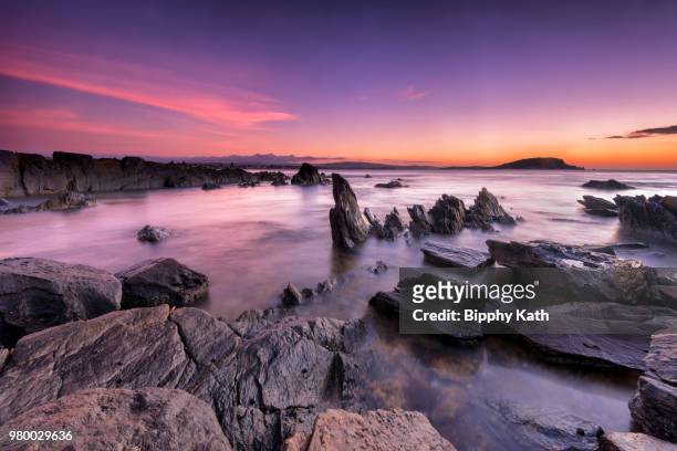 seascape with rock formations at sunset, encounter bay, adelaide, south australia, australia - bay adelaide stock pictures, royalty-free photos & images