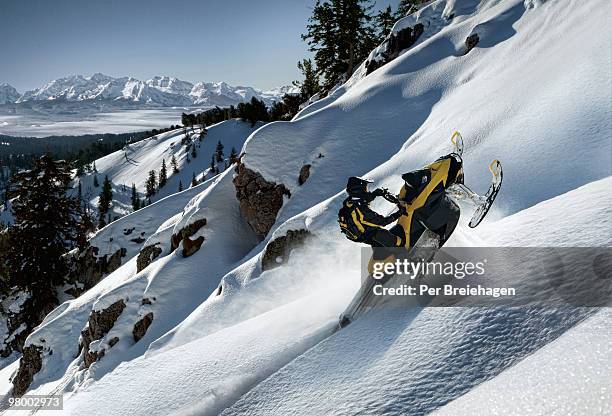 snowmobile climbing high - logan utah stock pictures, royalty-free photos & images