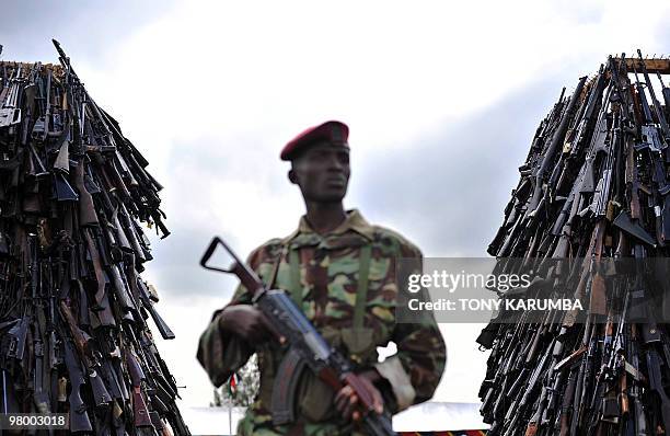 Cache of illegal fire arms is kept under tight security in Nairobi, March 24, 2010 before it is set abalaze as part of a campaign by the Kenyan...