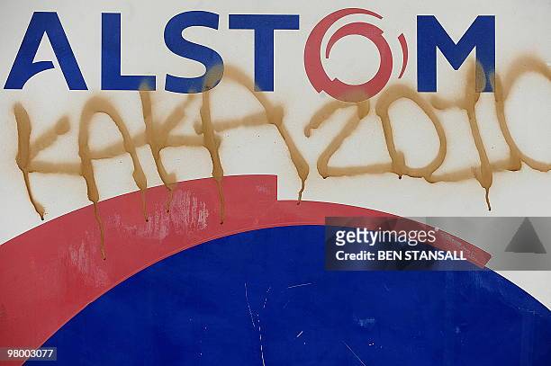 Graffiti is pictured on a sign outside the Alstom depot in Morden, in Surrey, on March 24, 2010. Three members of the board of French engineering...