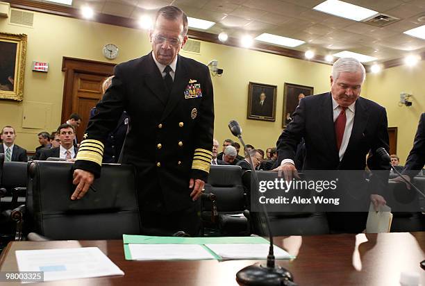 Secretary of Defense Robert Gates and Chairman of the Joint Chiefs of Staff Admiral Michael Mullen take their seats prior to a hearing before the...