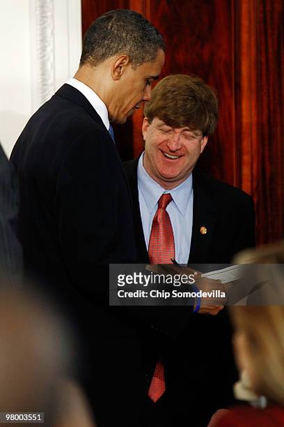 Rep. Patrick Kennedy gives U.S. President Barack Obama a copy of the Health Security Act , which his father the late Sen. Edward Kennedy introduced...