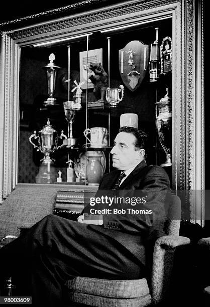 Everton Manager Harry Catterick sitting in front of the trophy cabinet at Goodison Park in Liverpool, 8th October 1962.
