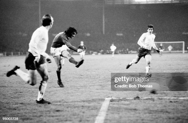 George Best shoots, watched by England defenders Nobby Stiles and Emlyn Hughes , to score for Northern Ireland during the British Home International...