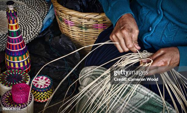 female weaving basket, cuenca, ecuador - basket weaving stock pictures, royalty-free photos & images