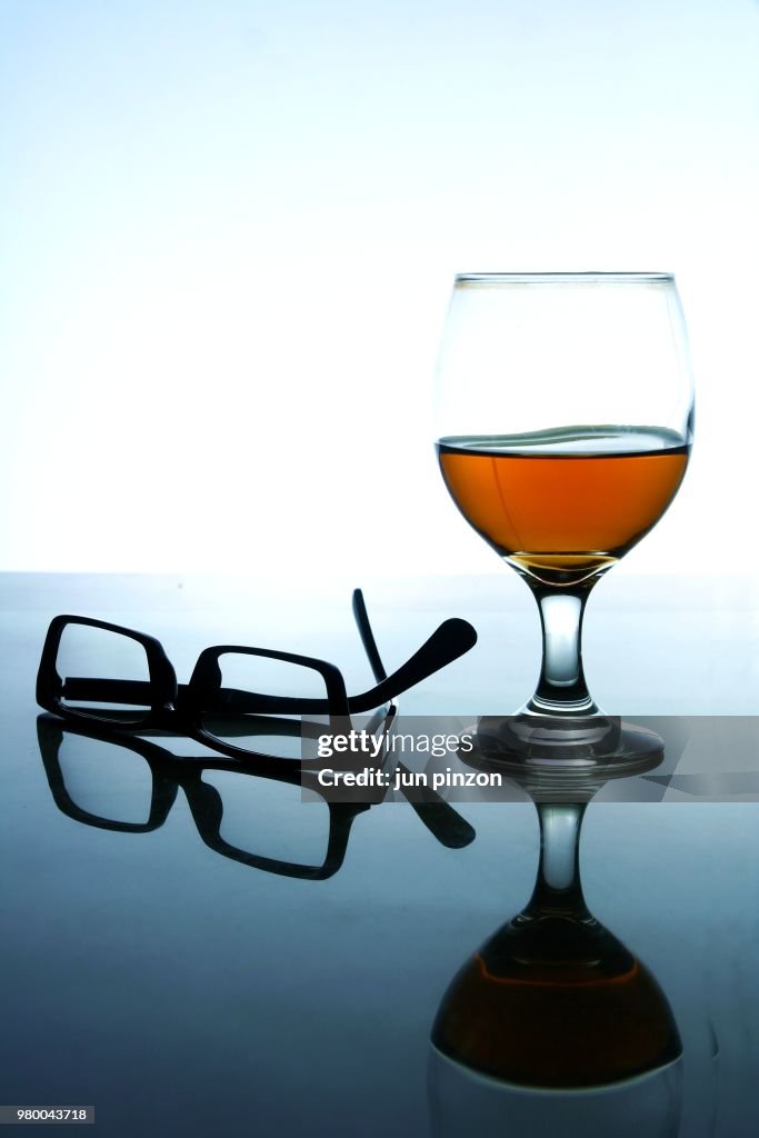 Alcoholic Drink and a pair of eyeglasses
