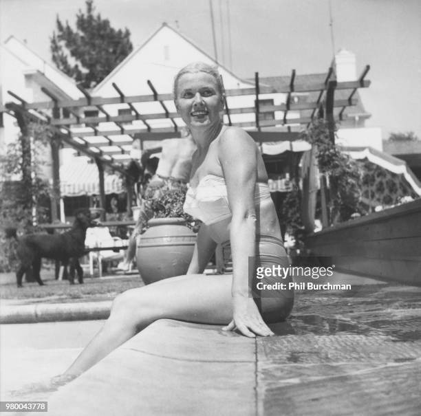 American actress and singer Doris Day by the pool at her home in Toluca Lake, Los Angeles, California, circa 1955. "n"n
