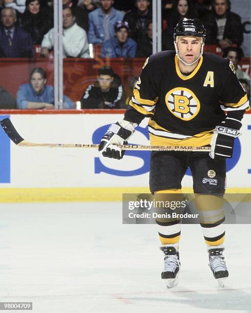 Adam Oates of the Boston Bruins skates against the Montreal Canadiens in the early 1990's at the Montreal Forum in Montreal, Quebec, Canada.