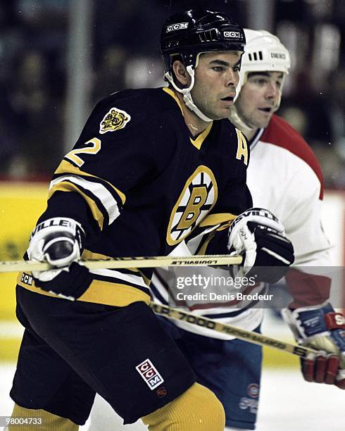Adam Oates of the Boston Bruins skates against the Montreal Canadiens in the early 1990's at the Montreal Forum in Montreal, Quebec, Canada.