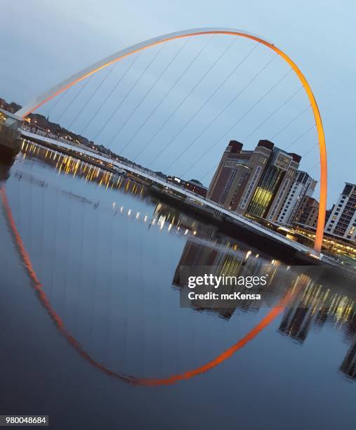 millennium bridge over river tyne linking newcastle and gateshead, with baltic contemporary art centre in background - gateshead millennium bridge stock pictures, royalty-free photos & images