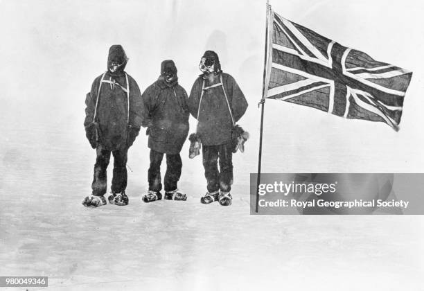 Beside the Union Jack at 'the farthest south', At 88 degrees 23' S Shackleton, Adams and Wild stand beside the Union Jack. This was the furthest...