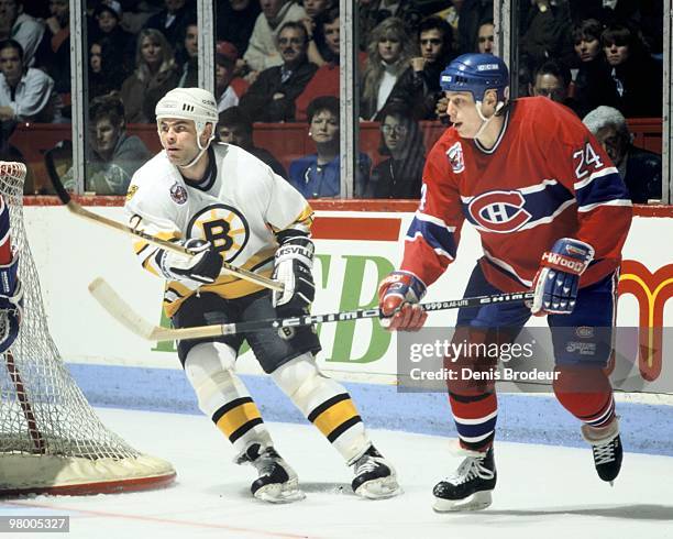 Adam Oates of the Boston Bruins skates against an opponent of the Montreal Canadiens in the early 1990's at the Montreal Forum in Montreal, Quebec,...