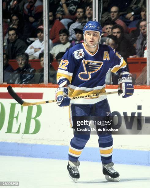 Adam Oates of the St. Louis Blues skates against the Montreal Canadiens in the early 1990's at the Montreal Forum in Montreal, Quebec, Canada.