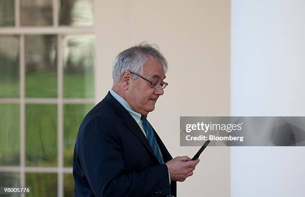 Representative Barney Frank, a Democrat from Massachusetts and House Financial Services Committee Chairman, checks his mobile phoone after speaking...