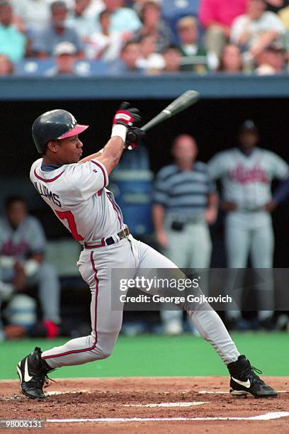 Outfielder Gerald Williams of the Atlanta Braves bats against the Pittsburgh Pirates during a Major League Baseball game at Three Rivers Stadium in...