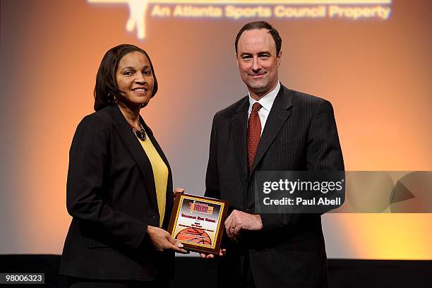 Rochelle Lowery principal at Chamblee Charter High School and winner of the "Eskew Award for Outstanding Sportsmanship" award poses for a photo with...