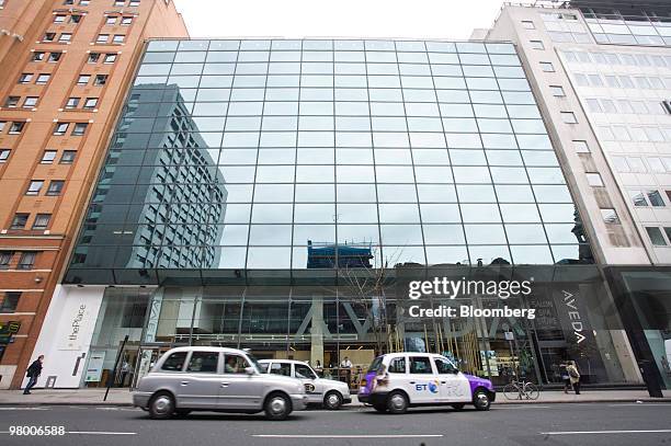 Taxis sit in front of Alstom SA's office housed at 175 High Holborn in London, U.K., on Wednesday, March 24, 2010. Three members of Alstom SA's board...