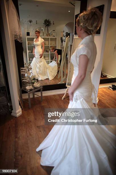 Bride to be Vicki Blaney tries on a wedding dress for size at I Do Bridal Designs in Cockermouth High Street on March 24, 2010 in Cockermouth,...