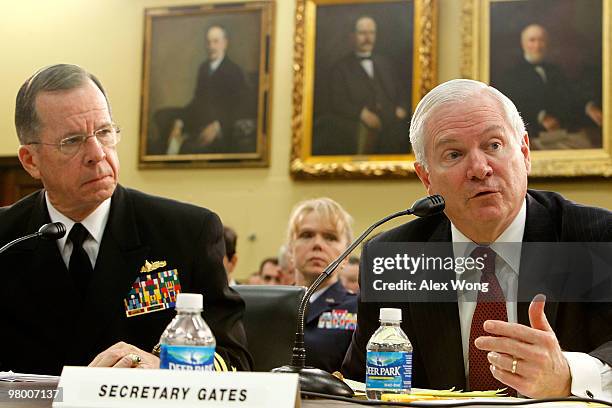 Secretary of Defense Robert Gates speaks as Chairman of the Joint Chiefs of Staff Admiral Michael Mullen looks on during a hearing before the Defense...